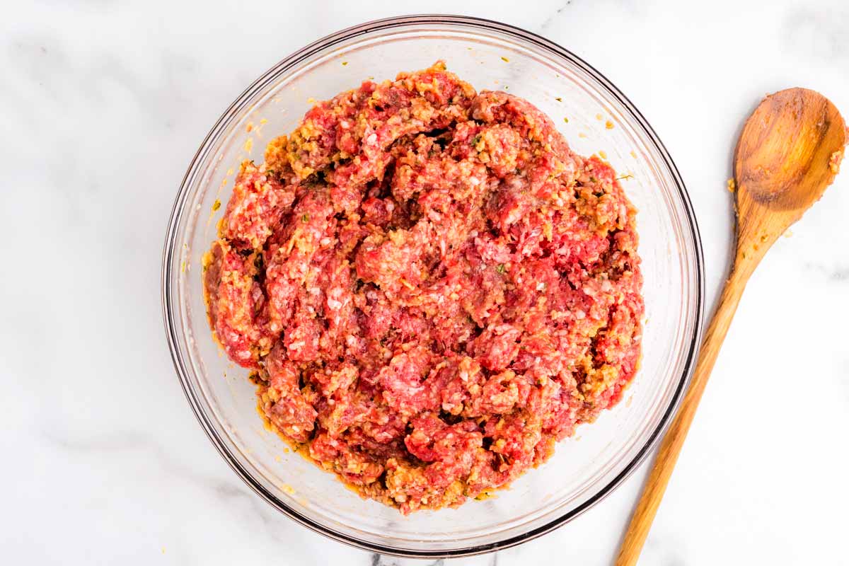 Meatloaf mixture in glass bowl.