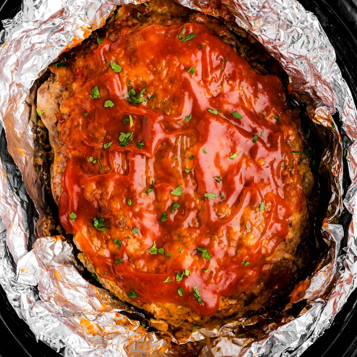 Meatloaf in crockpot with foil.