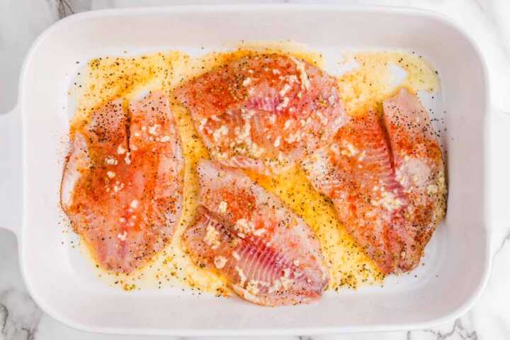 Tilapia with garlic butter ready for baking.