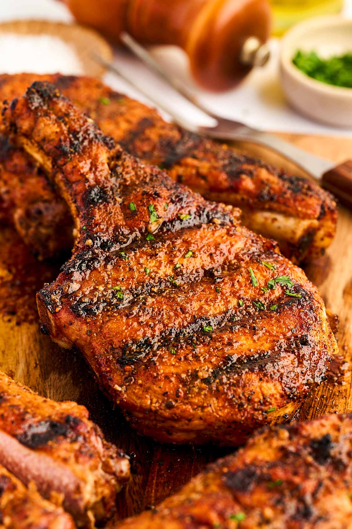 Grilled pork chops stacked.