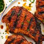 Grilled pork chop on a plate.