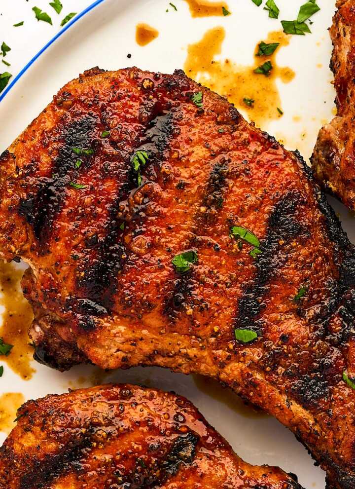 Grilled pork chop on a plate.