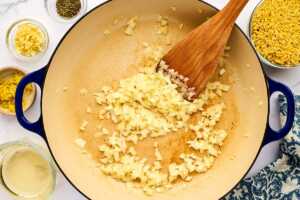 Sautéing onion in a pan.
