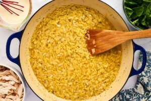 Cooking orzo in a pan.