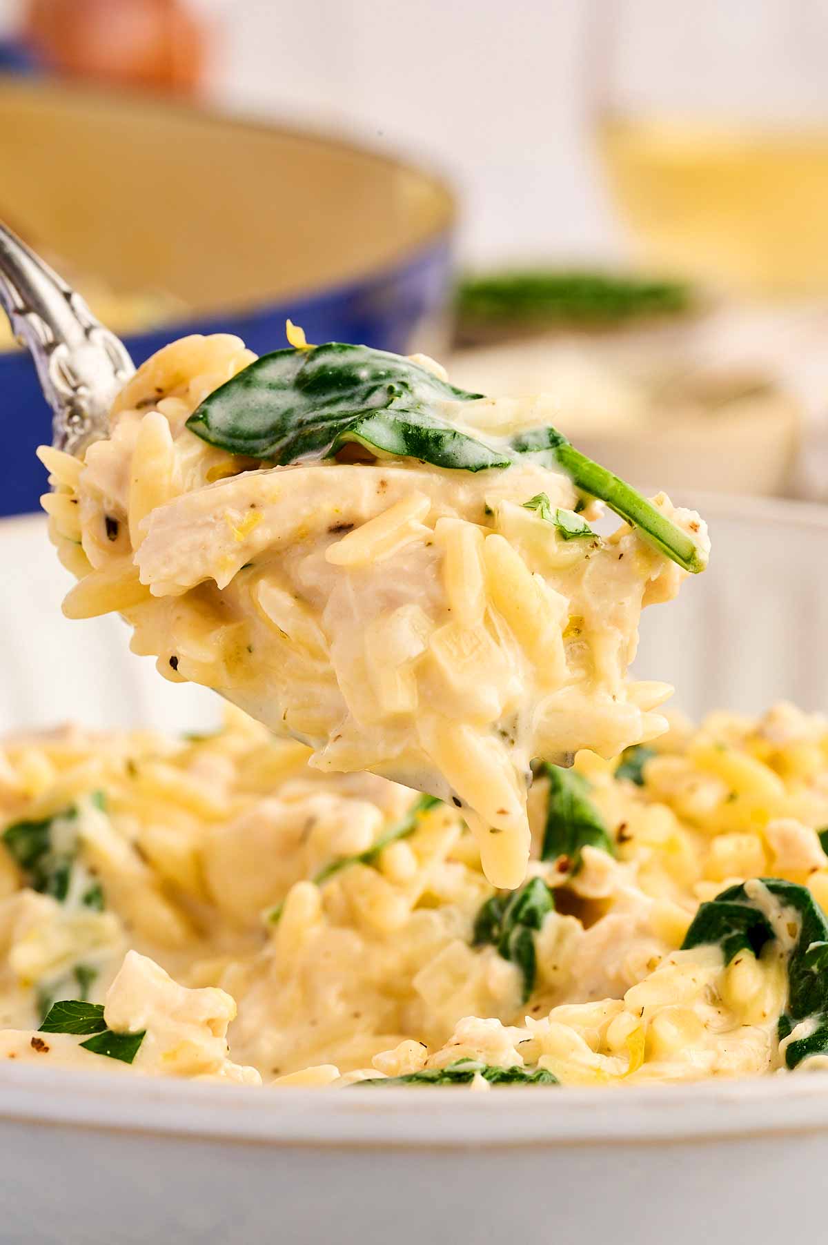 Fork with lemon chicken orzo.