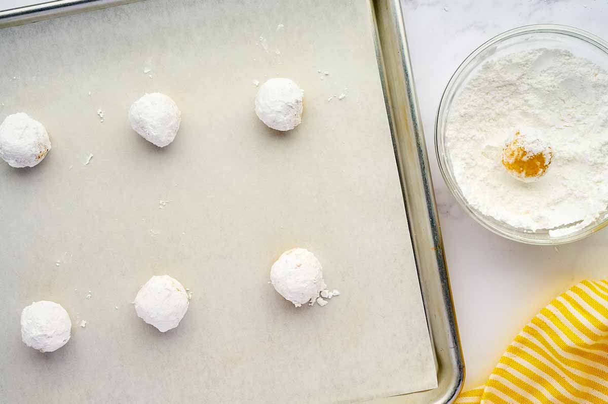 Unbaked lemon crinkle cookies.