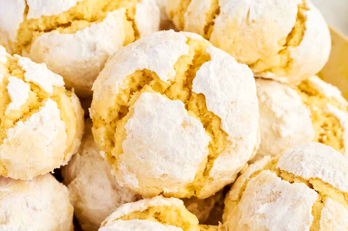 Close up photo of a lemon crinkle cookie.
