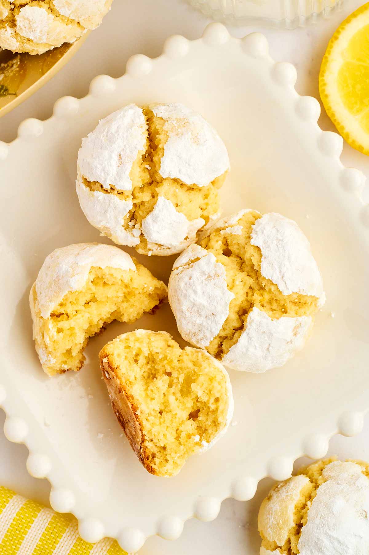 Lemon crinkle cookies on a plate.