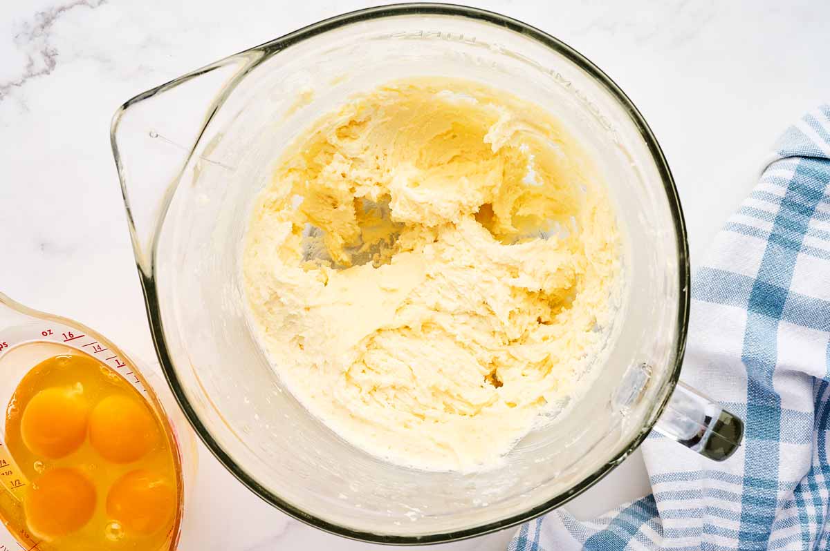 Creamed butter and sugar in a glass bowl.