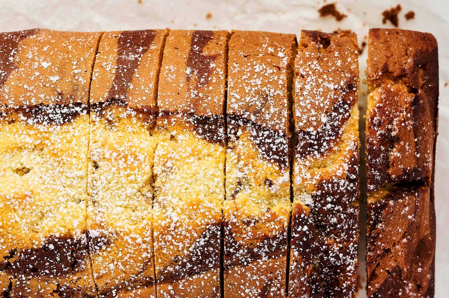 Marble loaf cake with powdered sugar.