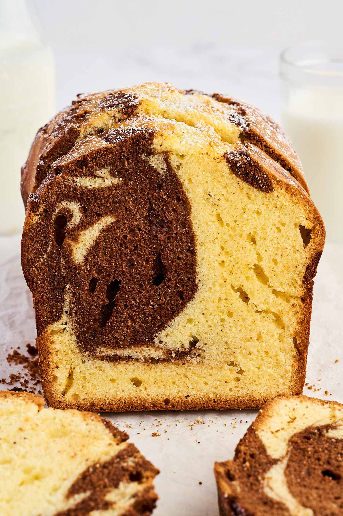Frontal view of sliced marble loaf cake.