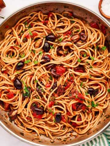 Skillet with pasta puttanesca.