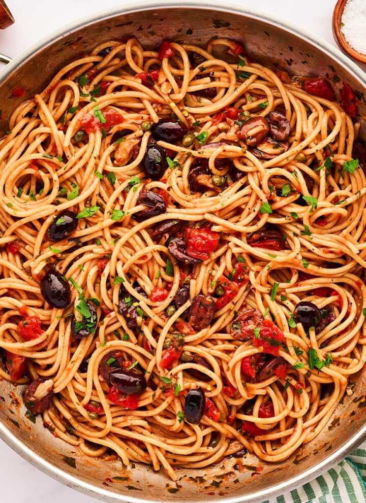 Skillet with pasta puttanesca.