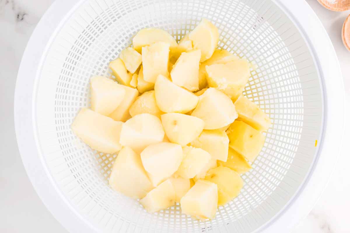 Drained potatoes in a colander.