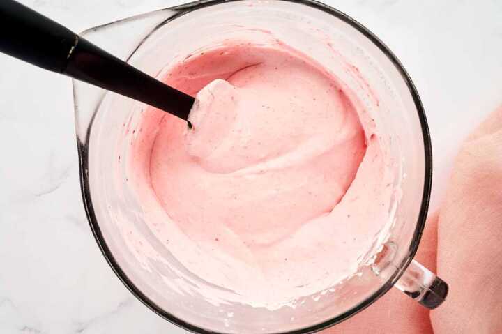 Strawberry mousse in glass bowl.