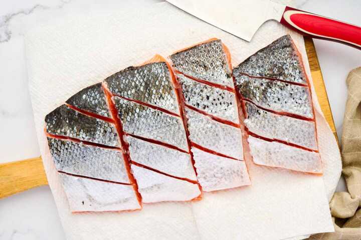 Prepping salmon for grilling.