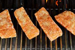 Salmon fillets on a grill.