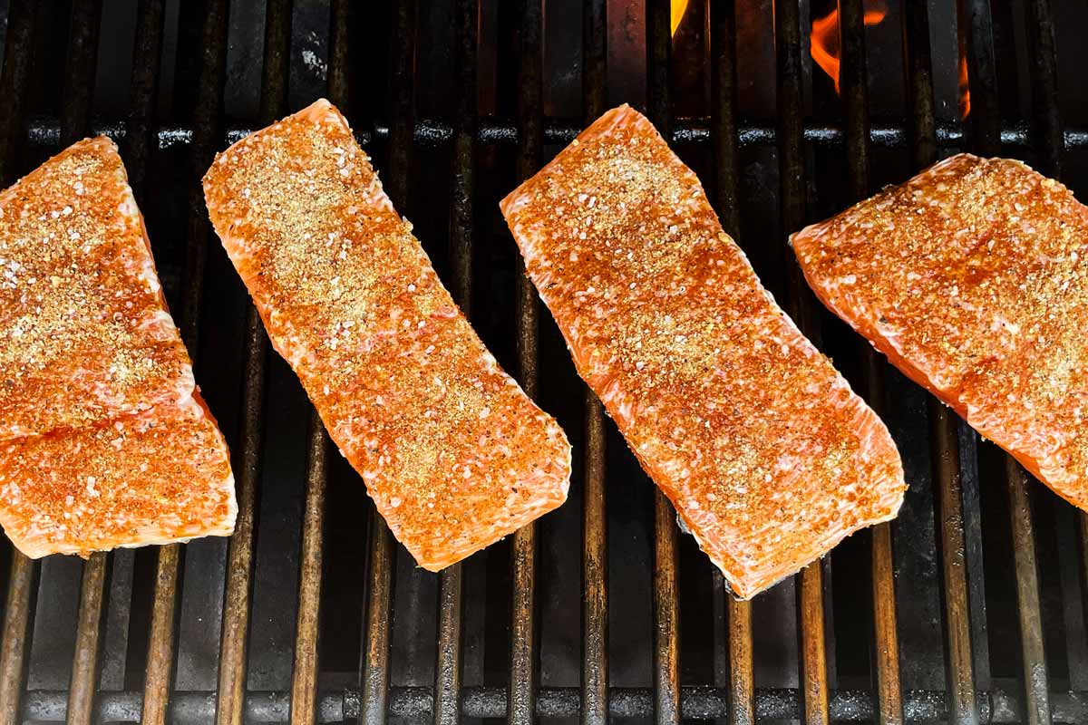 Salmon fillets on a grill.