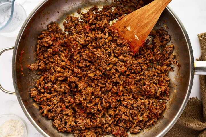 Making ground beef filling for enchiladas.