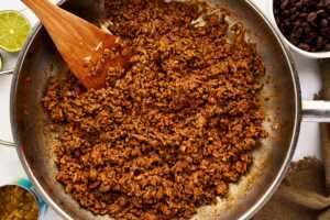 Ground beef enchilada filling in skillet.