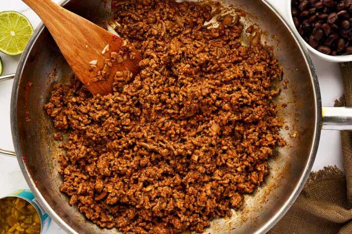 Ground beef enchilada filling in skillet.