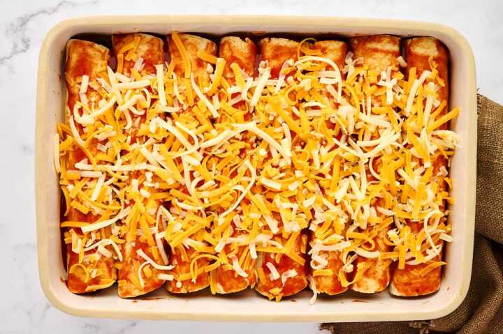 Assembled ground beef enchiladas before baking.