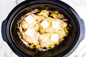 Uncooked Mississippi Chicken in slow cooker.