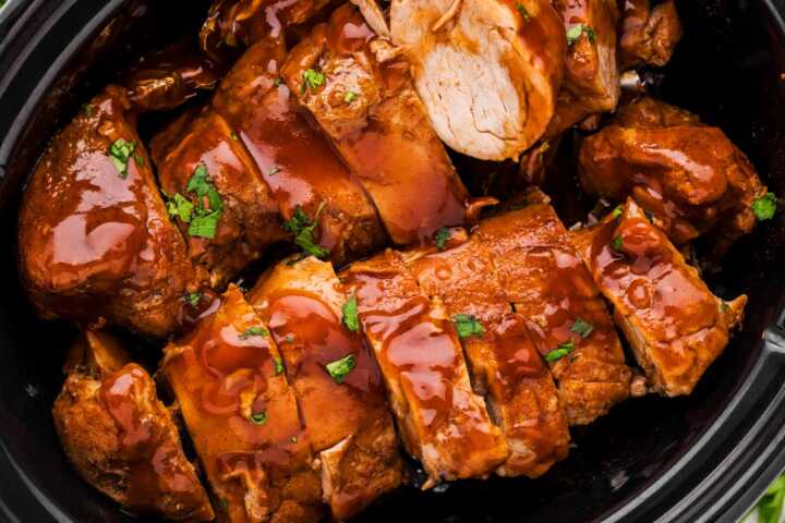 Close up overhead shot of sliced pork tenderloin in sticky glaze.