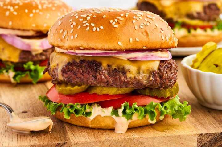 Burger on a wooden board.