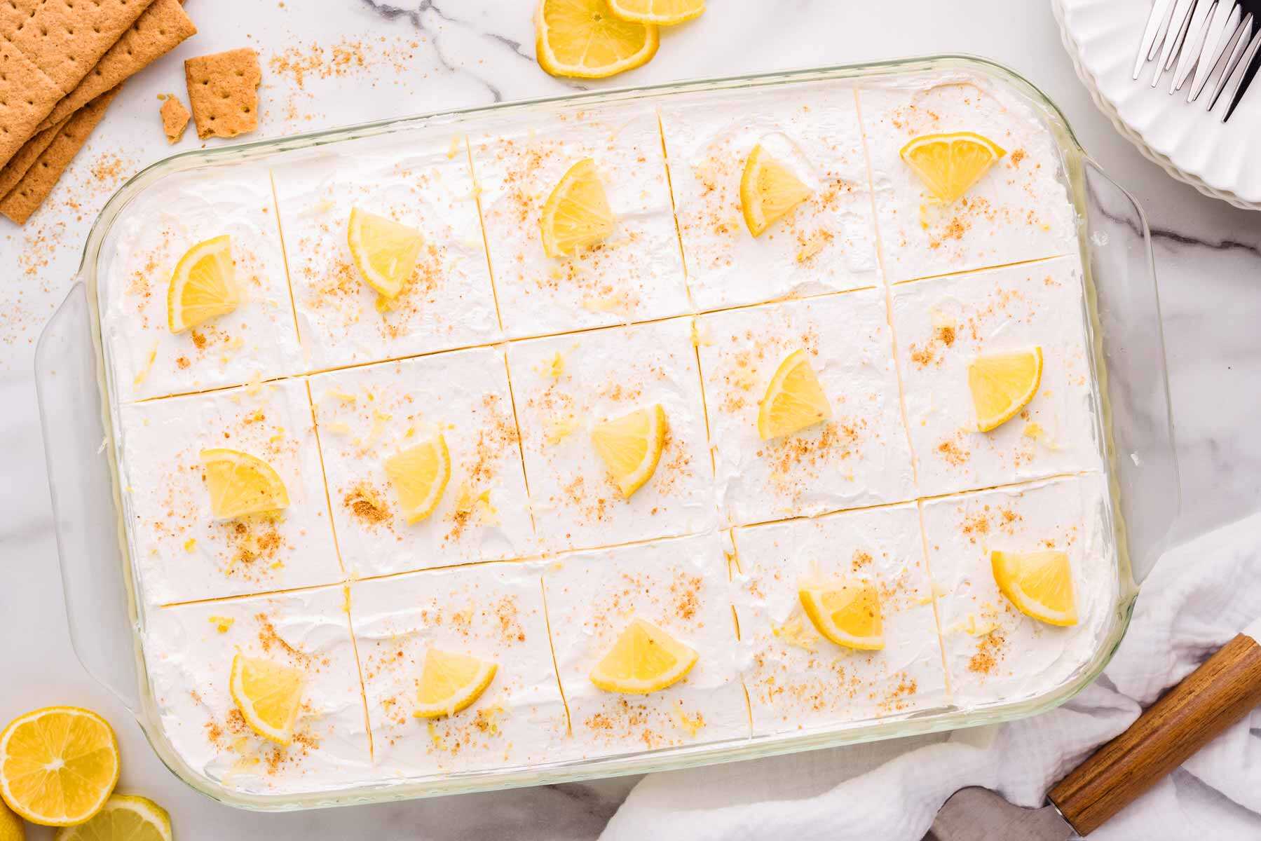 Finished lemon icebox cake sliced in a glass pan.
