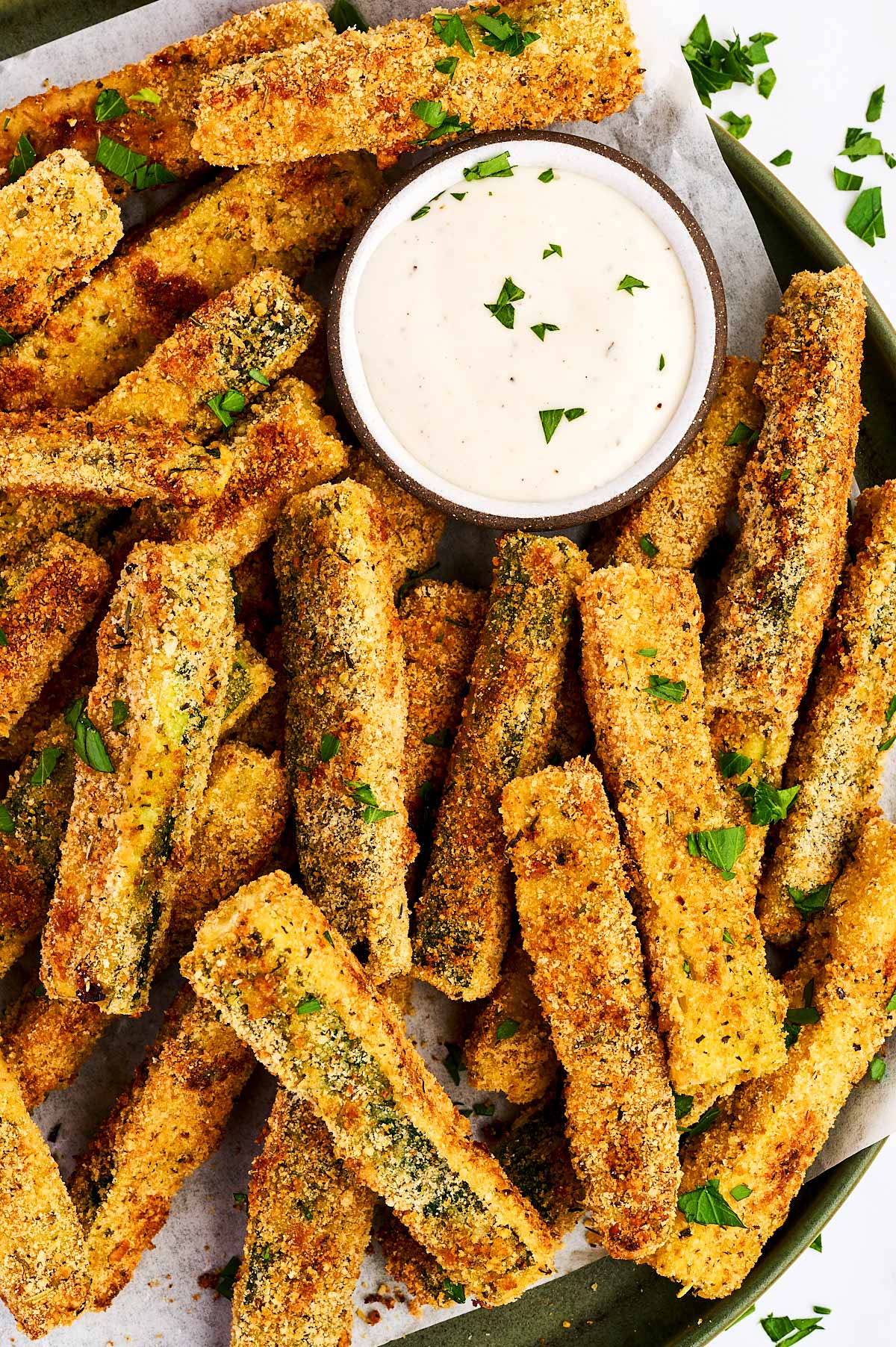Baked Parmesan Zucchini Fries on a platter with ranch dip.