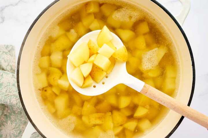 Draining diced potatoes.