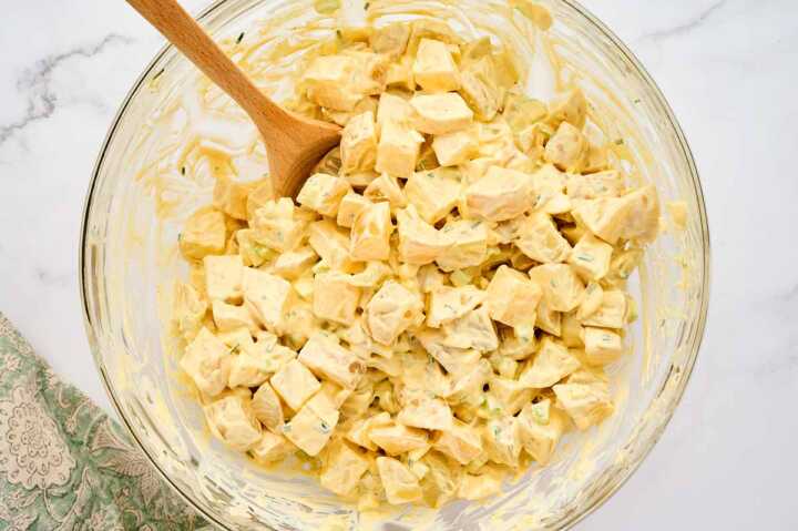 Mixed potato salad in a glass bowl.