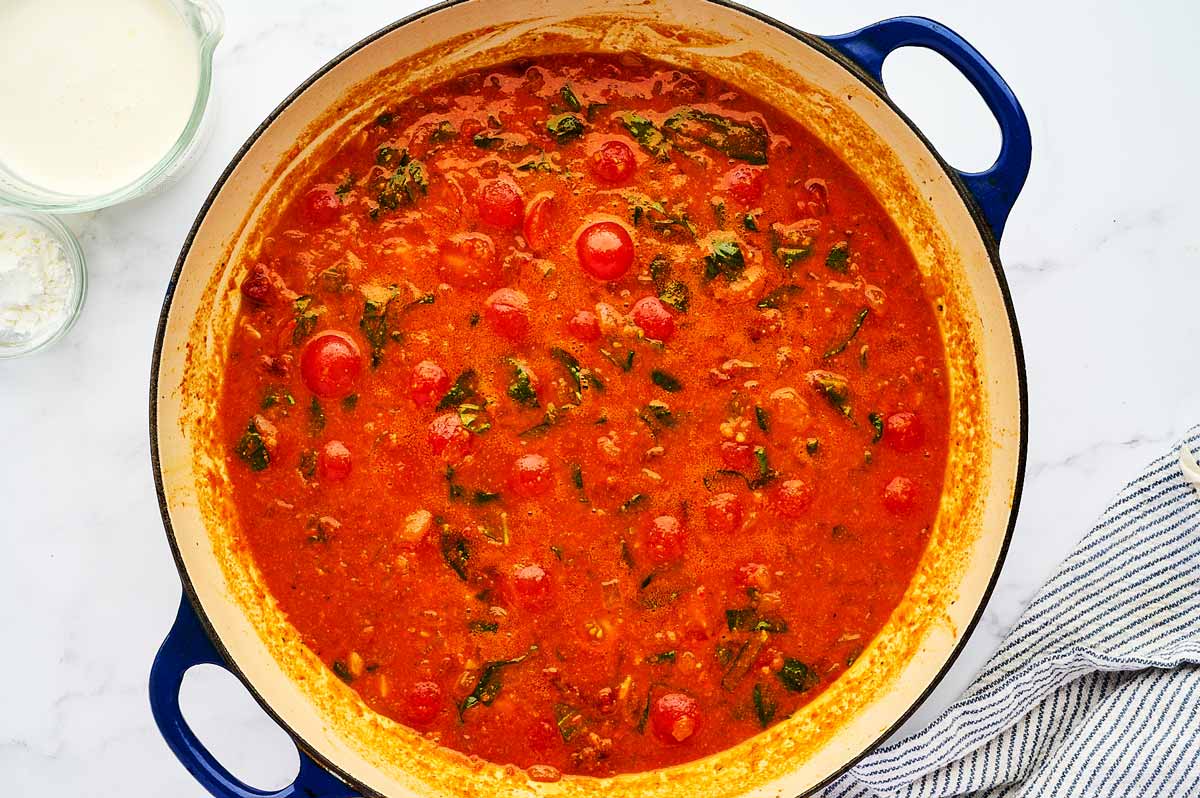 Simmering tomato sauce in a skillet.