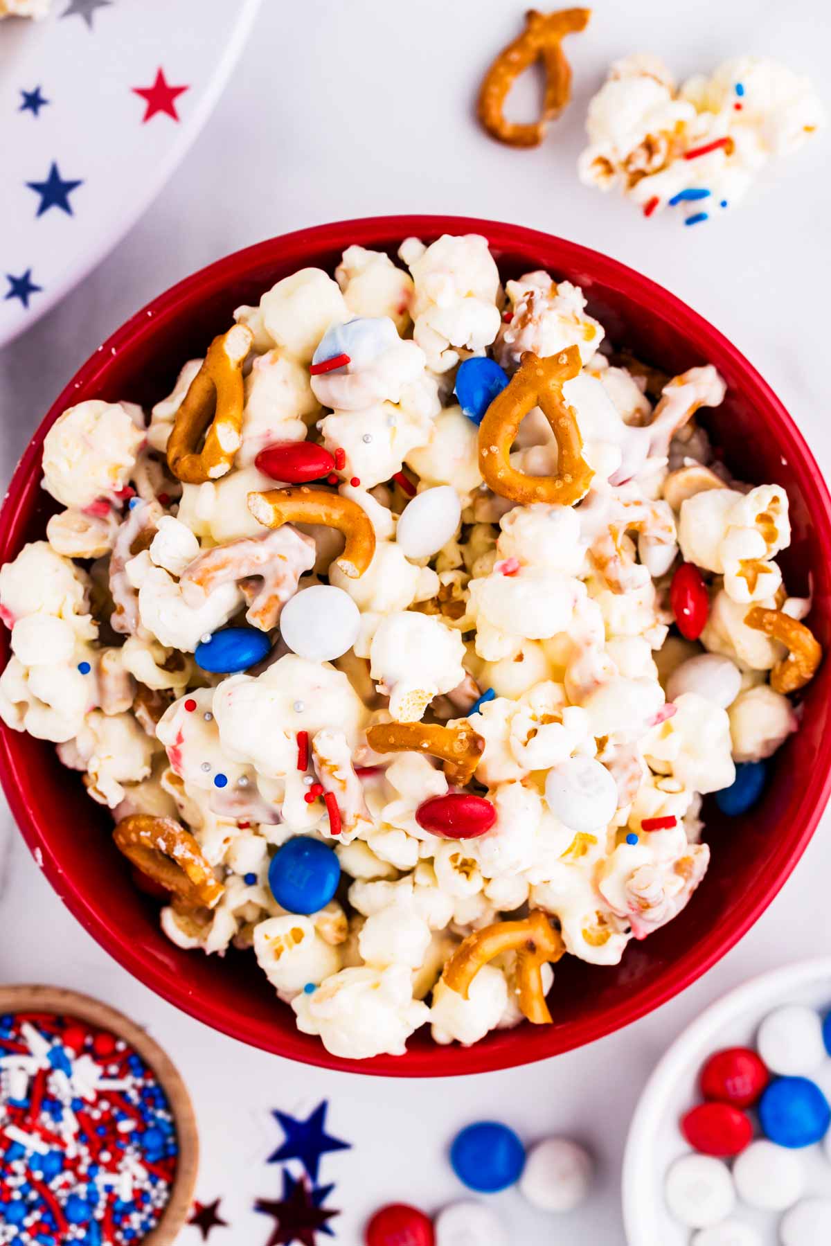 Bowl filled with red, white and blue popcorn.
