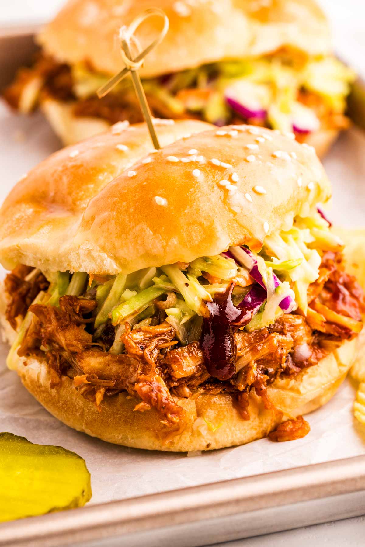 Slow Cooker BBQ Pulled Chicken sandwich with coleslaw.