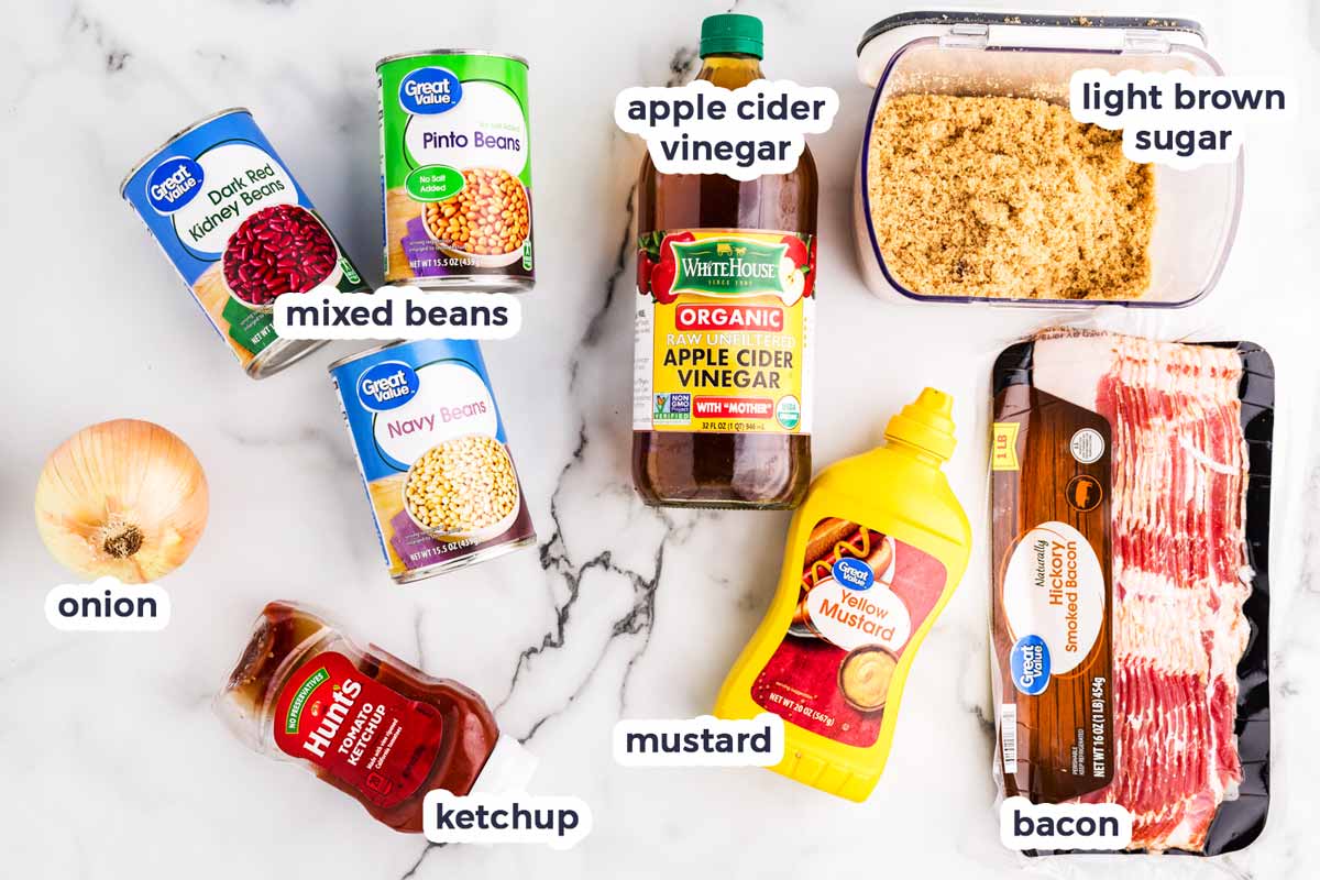 Ingredients to make Slow Cooker Baked Beans with text labels.