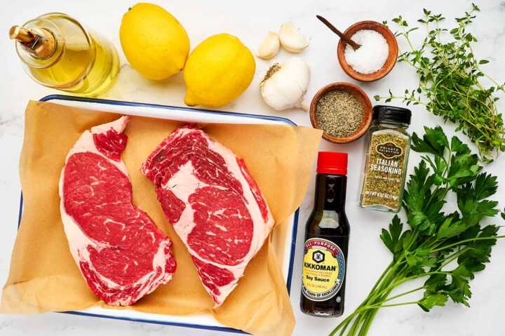 Ingredients to make steak marinade on marble surface.