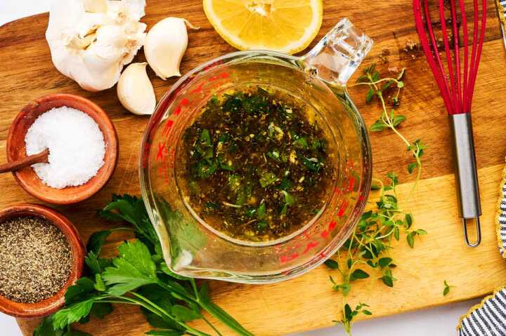 Steak marinade in glass measuring jug.