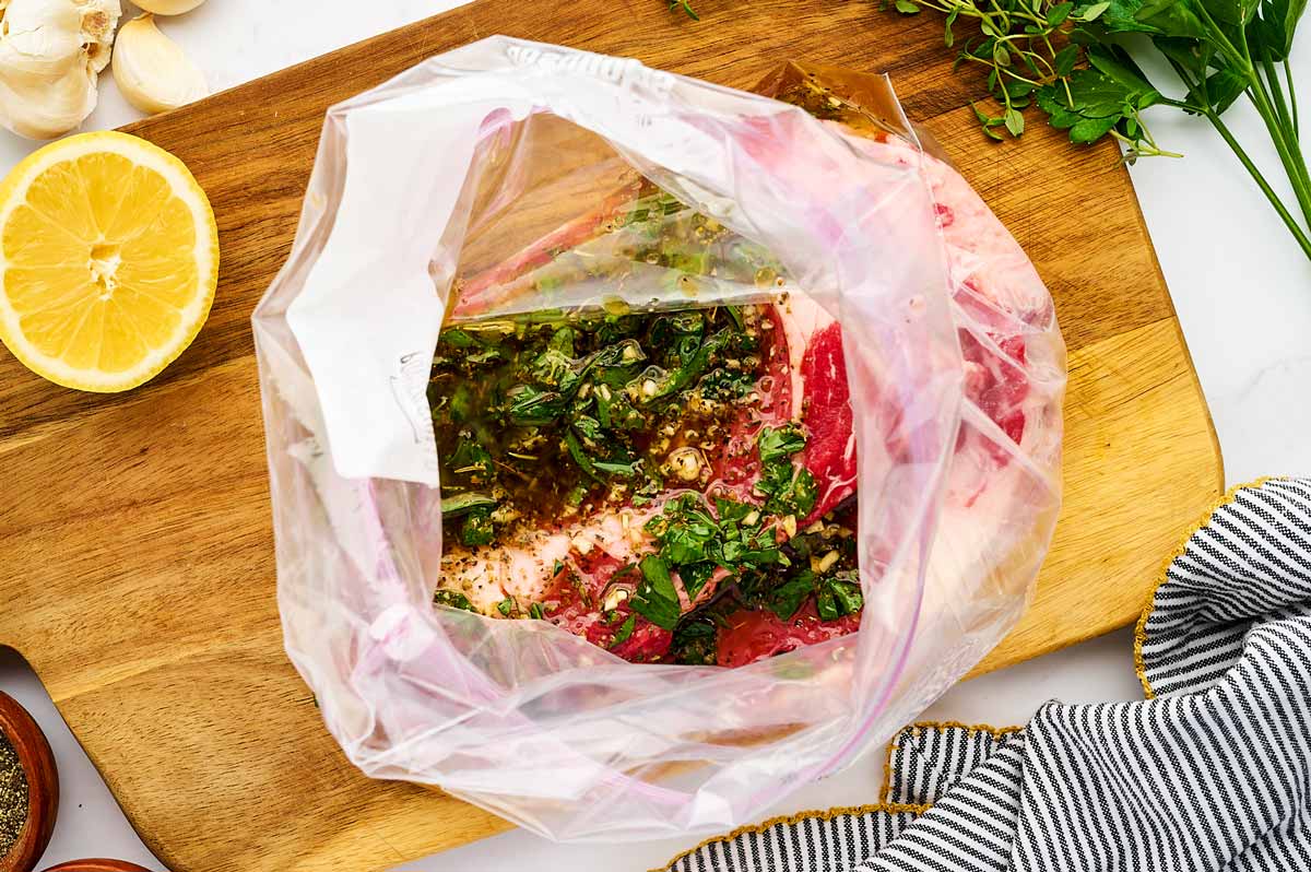 Steak with marinade in zip bag.