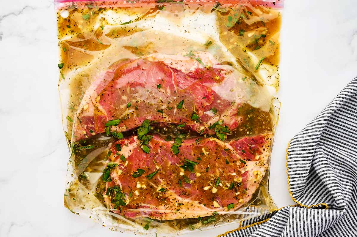 Steak in marinade in bag.