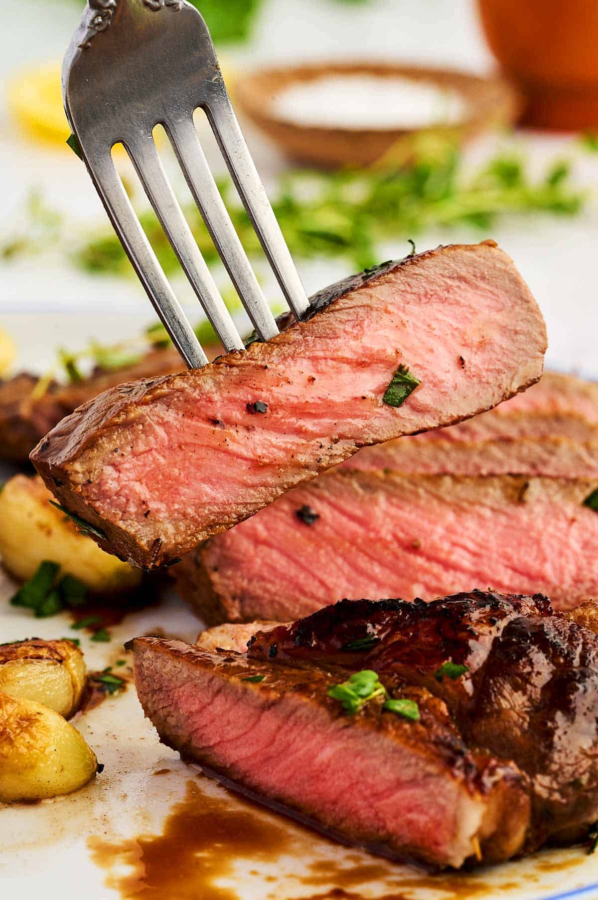 Piece of steak on a fork.