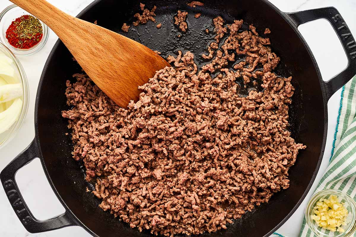 Ground beef browned in a skillet.