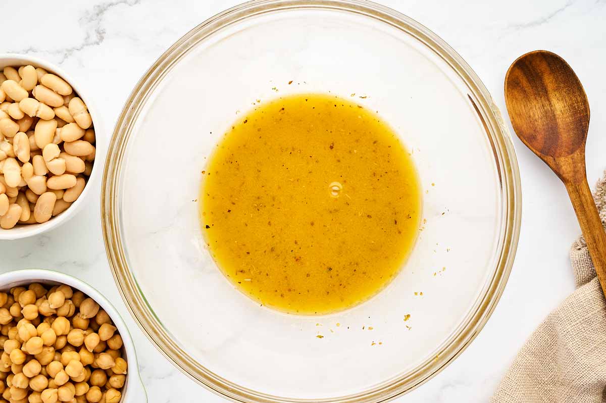 Greek salad dressing in a glass salad bowl.