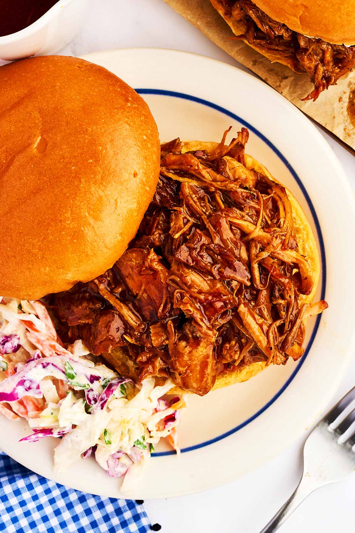 Overhead view of pulled pork on a bun.