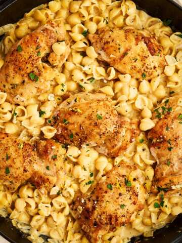 Serving chicken and pasta in a cast iron skillet.
