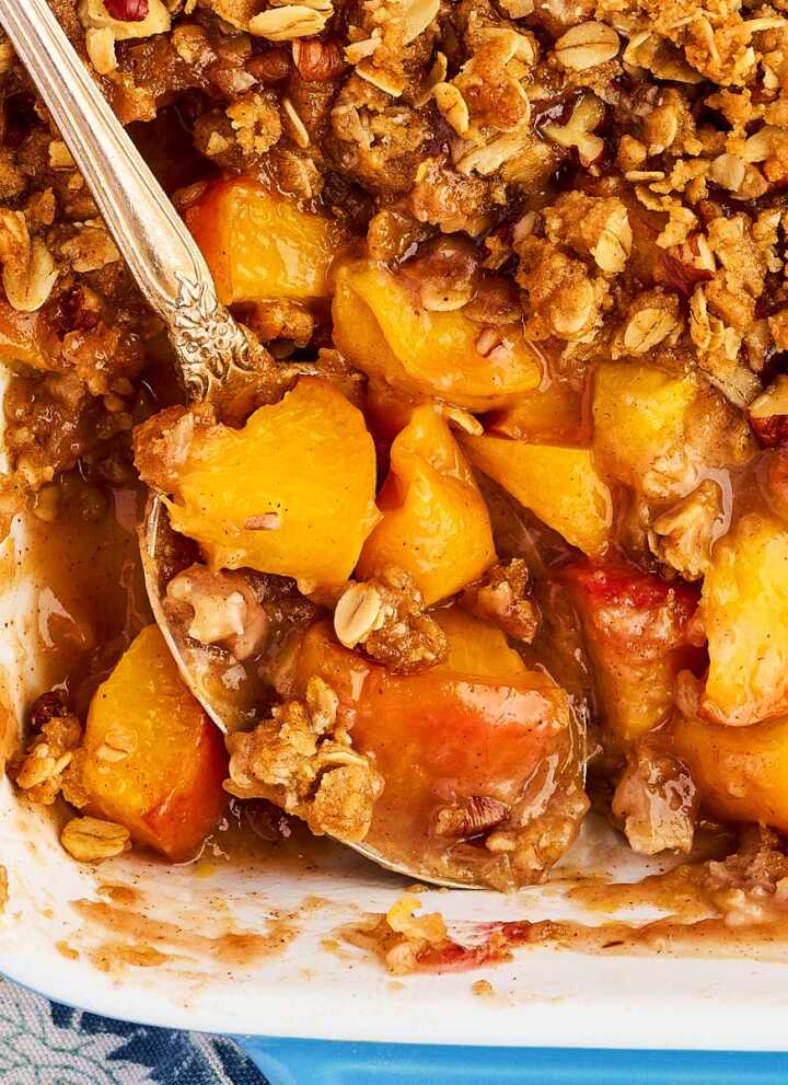 Overhead view of peach crisp with the peaches showing under the topping.