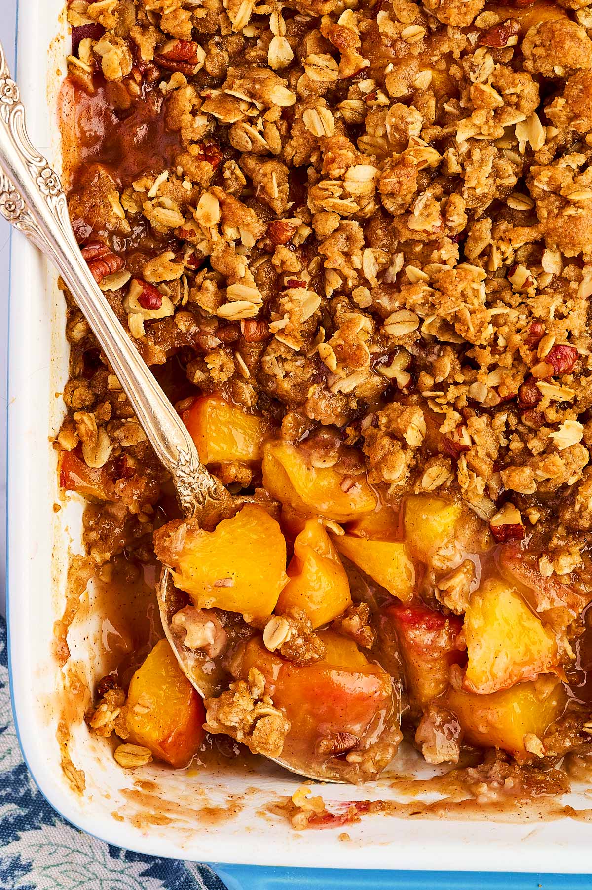 Overhead view of peach crisp with the peaches showing under the topping.