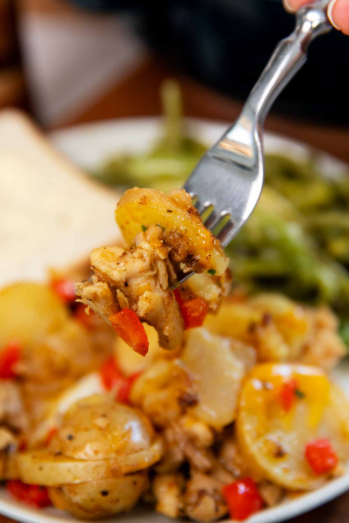 Fork with chicken and potatoes.