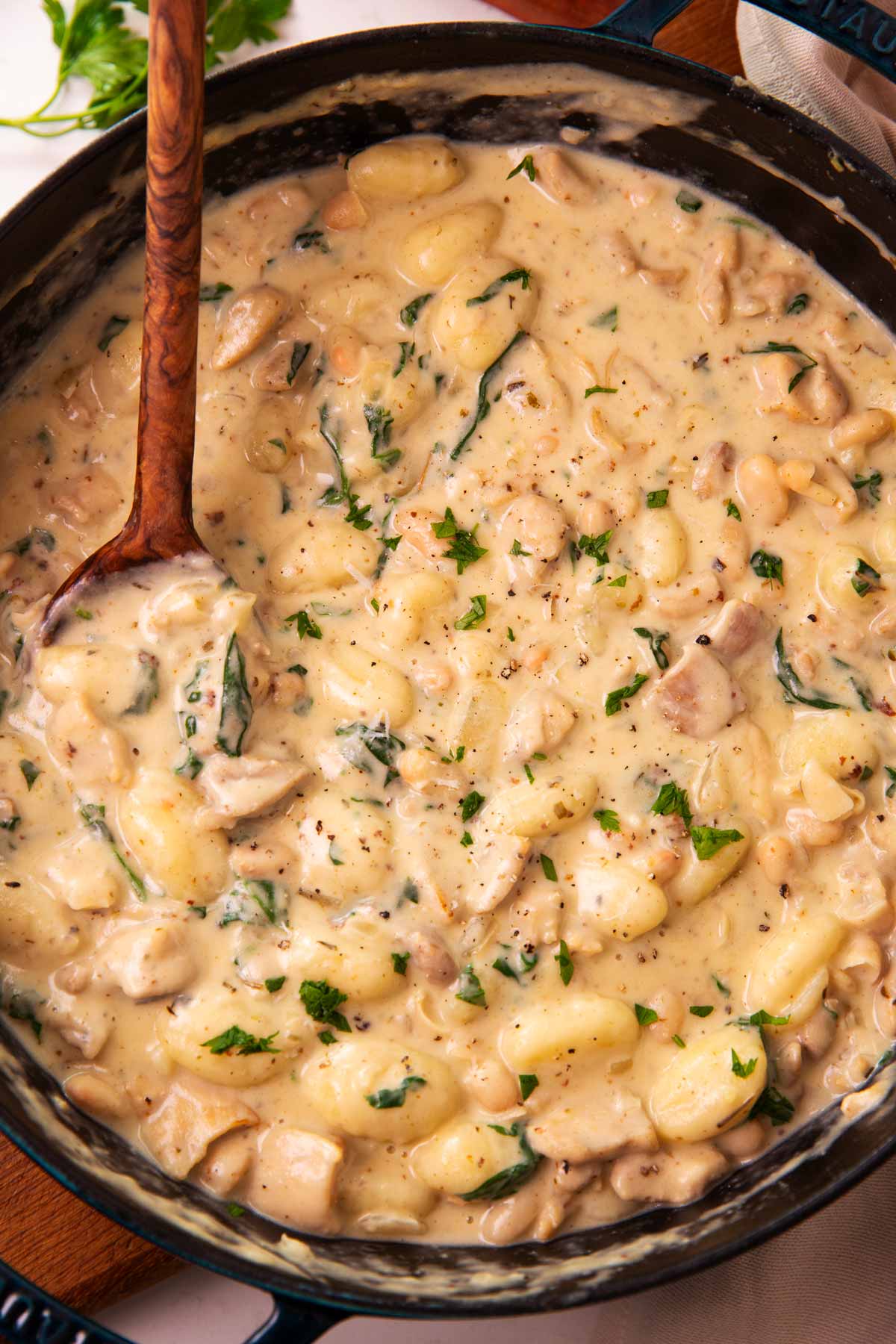 Overhead view of a pan filled with garlic parmesan chicken and gnocchi.